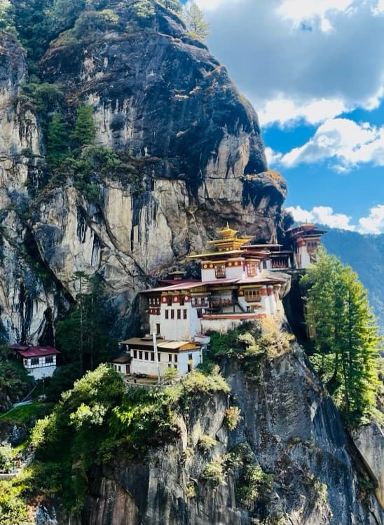 Paro Taktsang monastery on a steep forested cliff